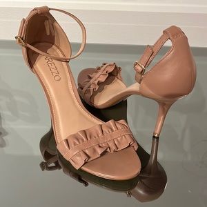 Frills heels in nude. Barely worn. Comfortable. Best shoes are made in Brazil.